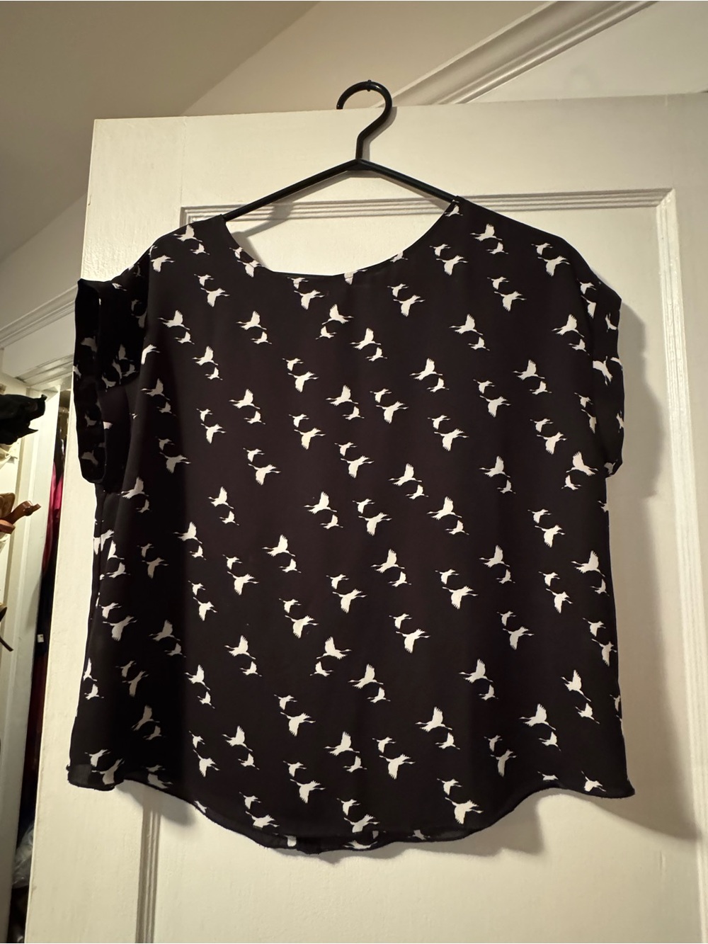 White birds on black summer blouse